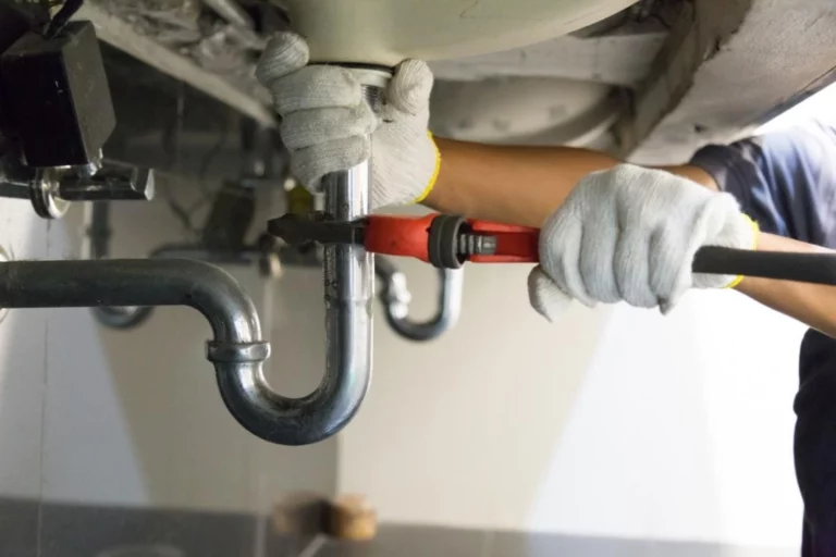 Plumbers in Katy, TX - 65a9454f7b522c7b3d24056d plumber fixing white sink pipe with adjustable wrench picture id1150199946